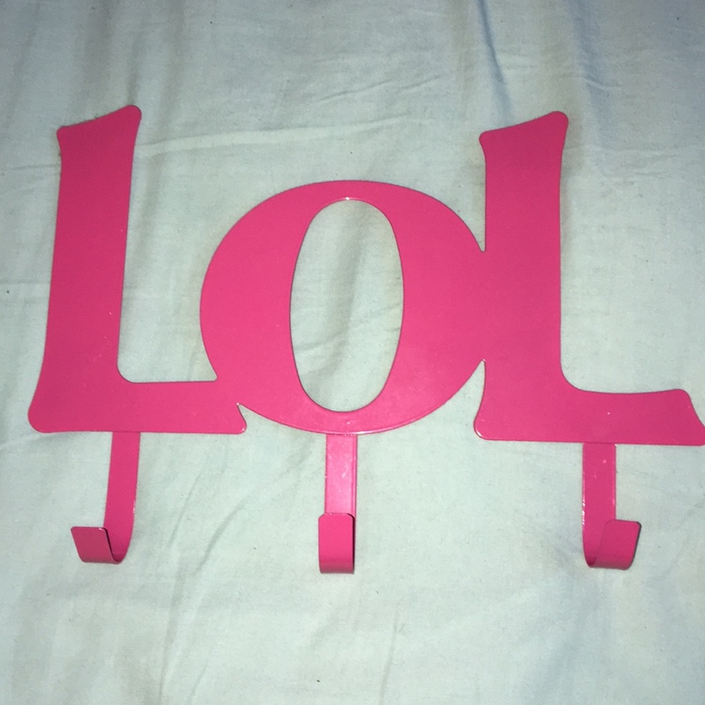 Metal pink jacket/coat/scarf holder.